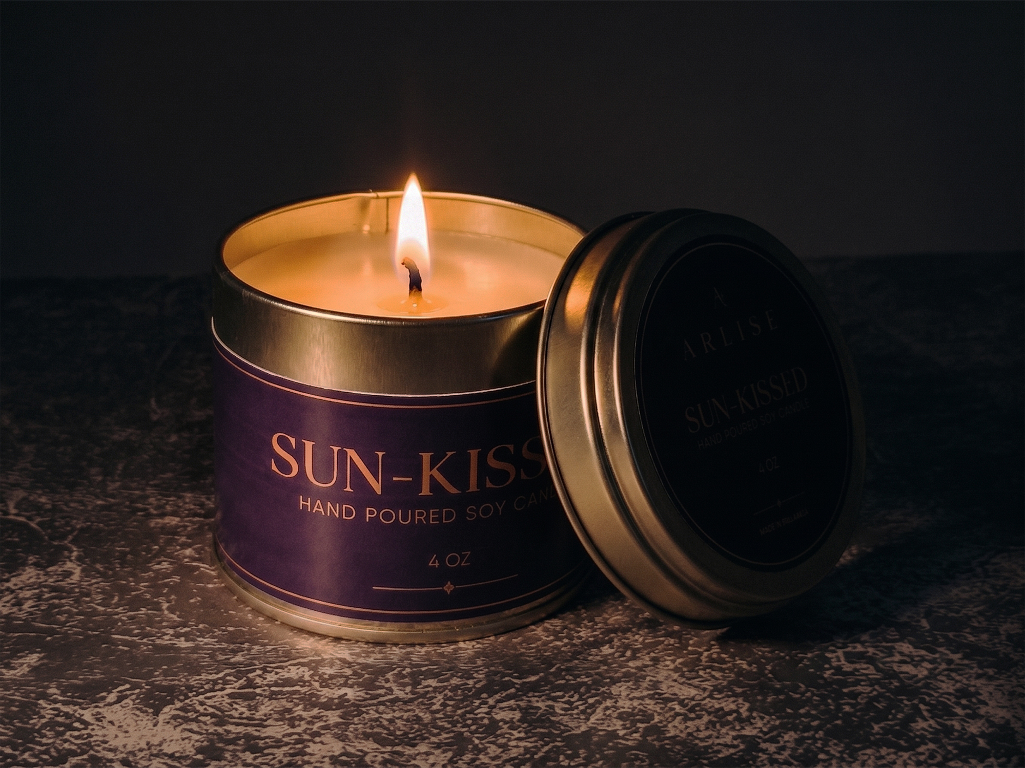 SUN-KISSED lemongrass soy candle burning in a darkened room
